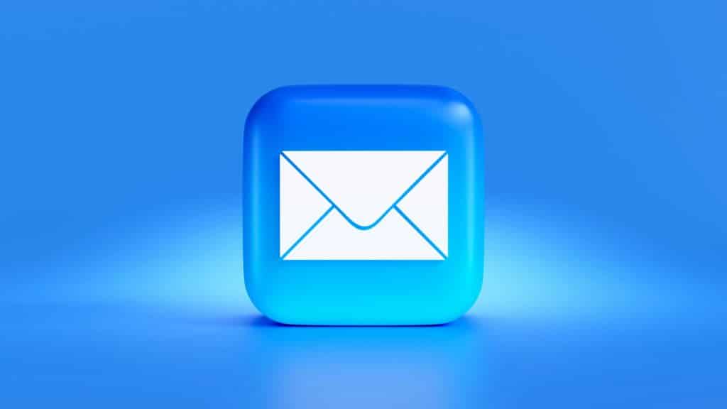A white envelope signalling emails is inside a blue square as the email app logo. This is on a blue and white background.